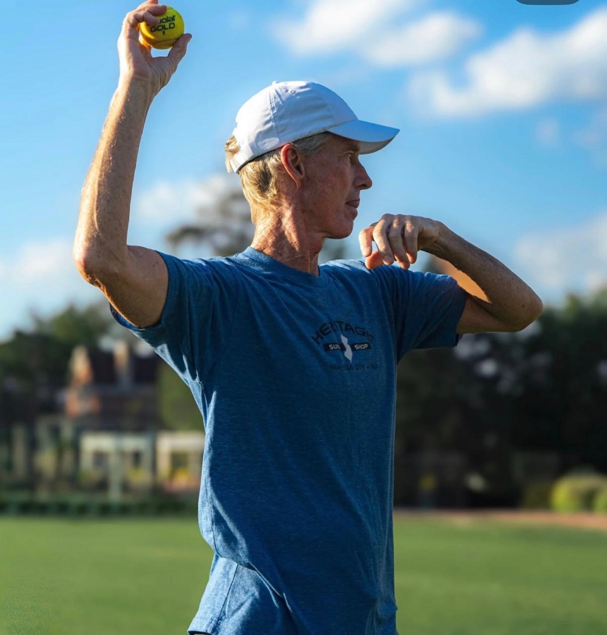 A player preparing to bowl a tennis ball at GCC
