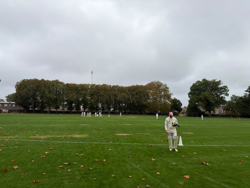 A Germantown batter in whites on the Manheim outfield